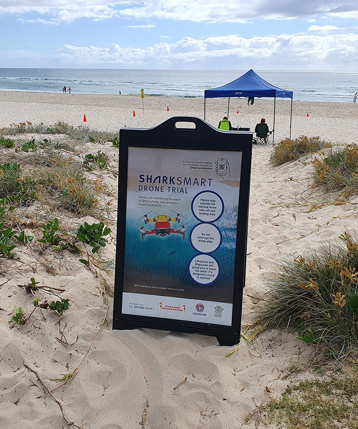 Sign telling beach goers that a drone trial is in progress