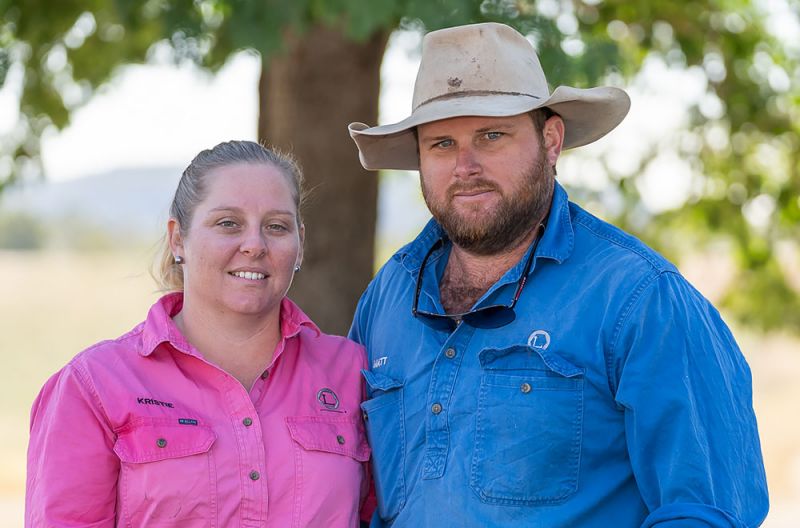 Graziers Kristie and Matt Lisle standing together in front of a tree